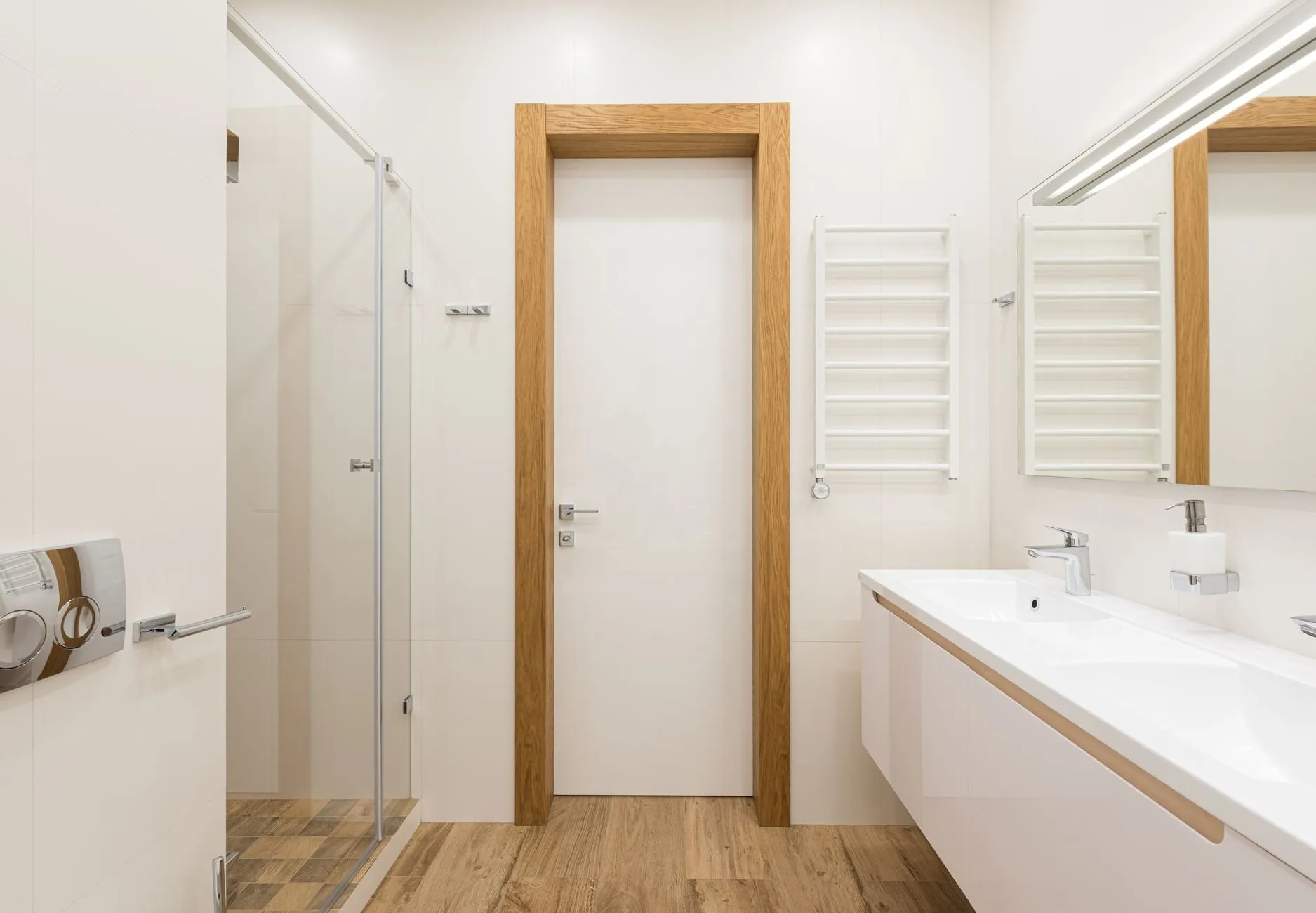 Bathroom with a walk-in shower and oak-framed door